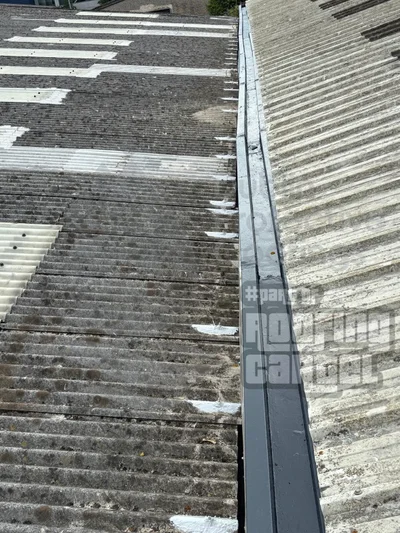 Bolt hole leak repair on asbestos cement roof showing waterproof sealant application by HSA licensed specialists