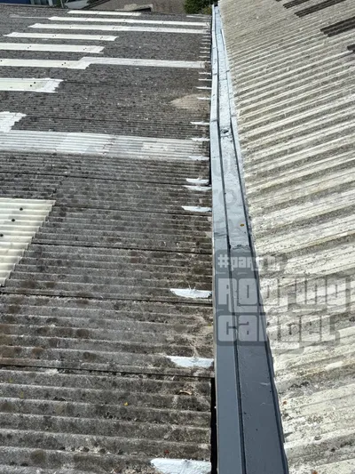 Bolt hole leak repair on asbestos roof with waterproof sealant