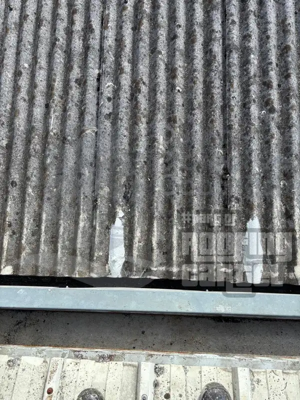 Lava 20 spot repair on cracked asbestos roof section showing instant cure waterproofing