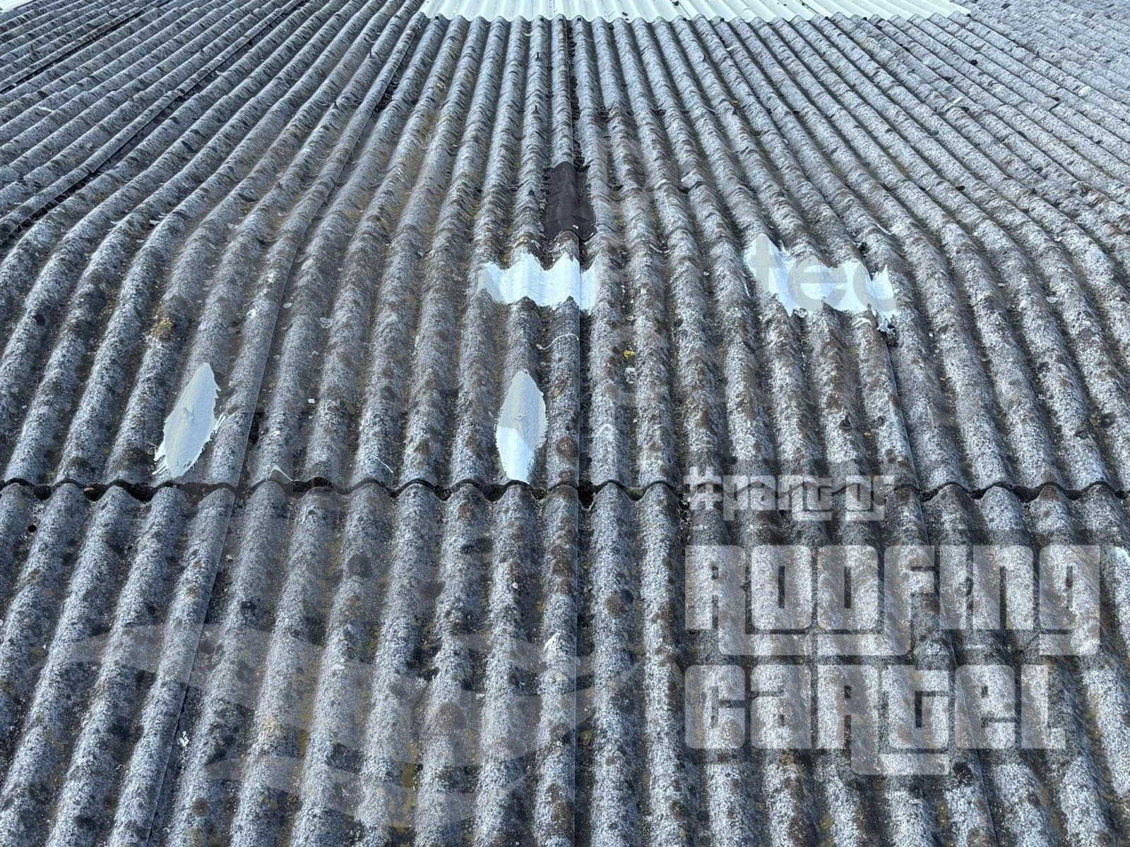 Completed Lava 20 patch repair on asbestos roof demonstrating UV stable finish and professional waterproofing application