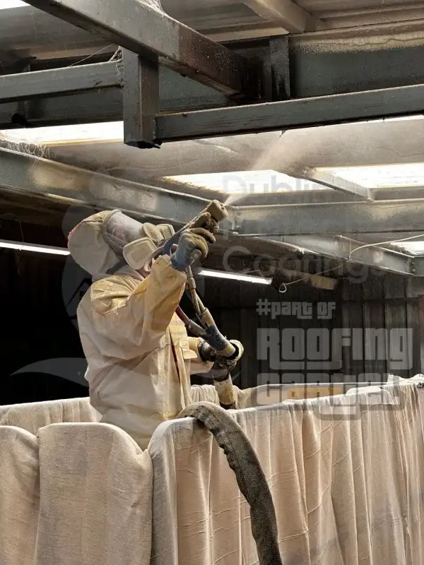 Spray foam insulation application on commercial building asbestos roof in Dublin Ireland
