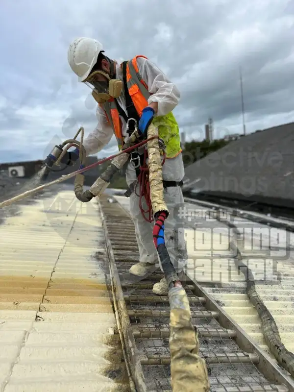 Spray foam application on freshly cleaned asbestos roof at office building in Cork