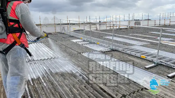 Professional asbestos roof cleaning process using pressure washing equipment in Dublin